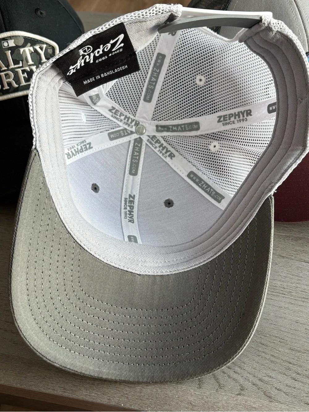 Zephyr Gray and White Trucker Hat with Colorful Howl Patch